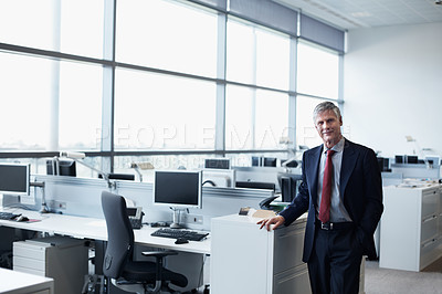 Buy stock photo Portrait of a confident senior businessman standing in an office