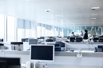 Buy stock photo Shot of three businesspeople discussing something in the office