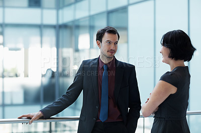 Buy stock photo Shot of two businesspeople having a conversation in an office setting