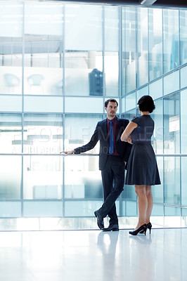 Buy stock photo Shot of two businesspeople having a conversation in an office setting
