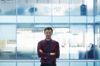 Buy stock photo Portrait of a smiling young businessman in an office setting