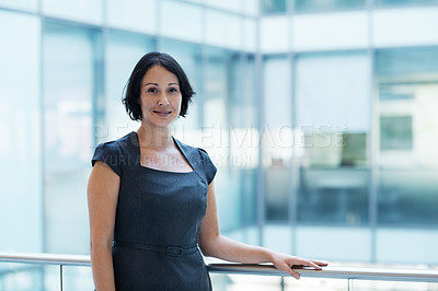 Buy stock photo Portrait of a smiling young businesswoman in an office setting