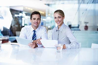 Buy stock photo Portrait of two businesspeople working together in an office