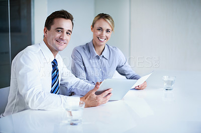 Buy stock photo Portrait of two businesspeople working together in an office