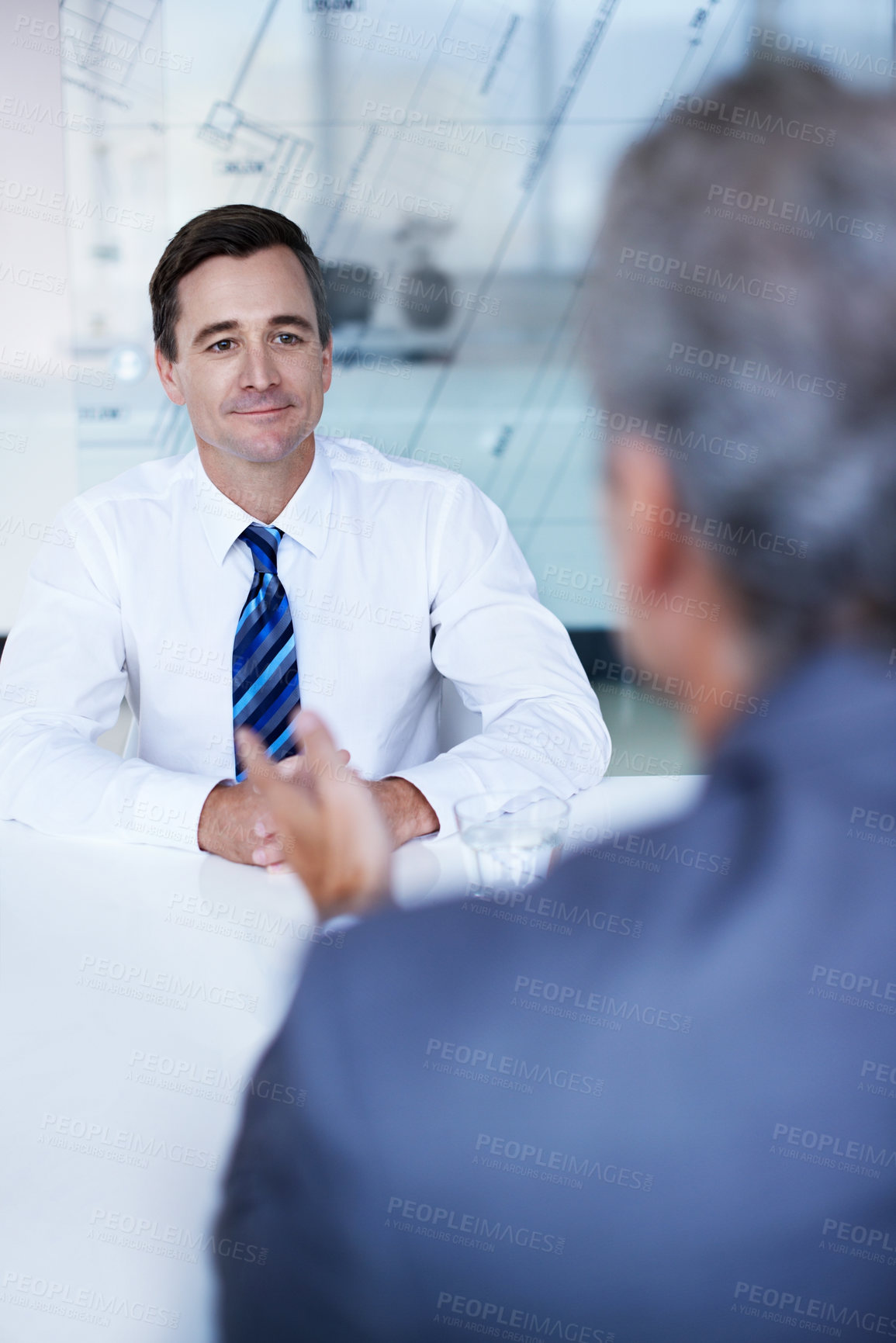 Buy stock photo Businessman, smile and interview for discussion, hiring process and blueprint overlay in office. Conversation, architect firm and person with applicant for job opportunity, onboarding or review