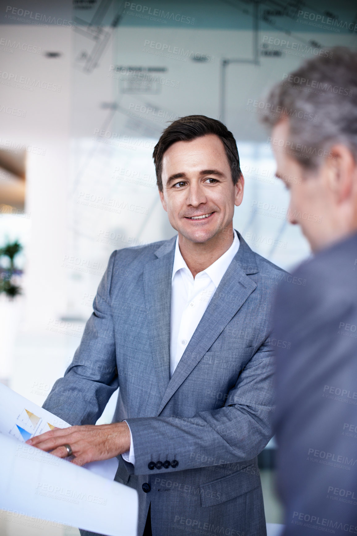 Buy stock photo Business, team or happy man with paperwork in meeting for finance forecast, revenue analysis or KPI. Investor, manager or smile with graphs in office for company profit, budget report or performance