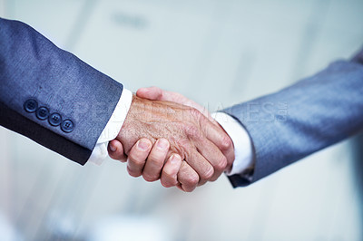 Buy stock photo Cropped closeup shot of two businessmen shaking hands