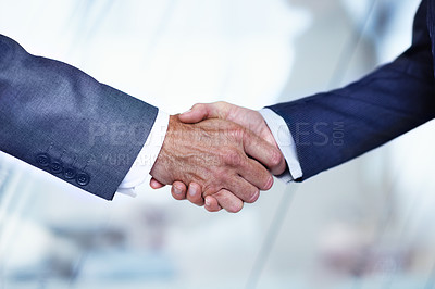 Buy stock photo Cropped closeup shot of two businessmen shaking hands