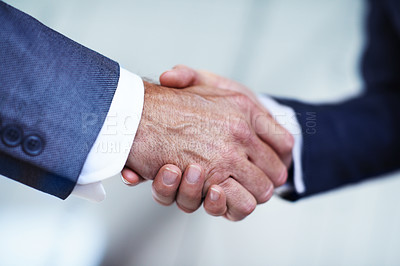 Buy stock photo Cropped closeup shot of two businessmen shaking hands