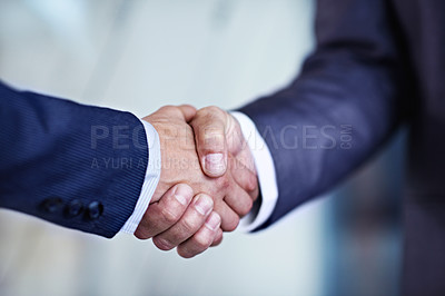 Buy stock photo Cropped closeup shot of two businessmen shaking hands