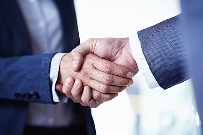 Buy stock photo Cropped closeup shot of two businessmen shaking hands