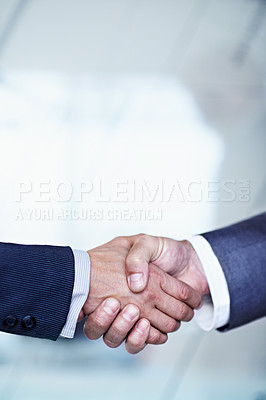 Buy stock photo Cropped closeup shot of two businessmen shaking hands