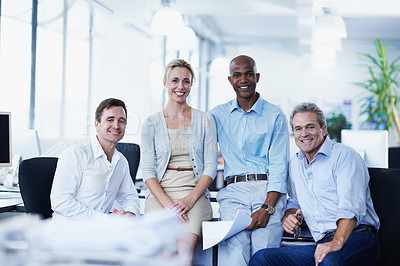 Buy stock photo Portrait of a group of smiling businesspeople in an office