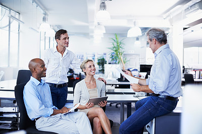 Buy stock photo Shot of a diverse group of businesspeople having a brainstorming session in an office