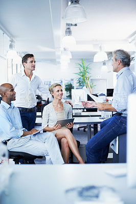 Buy stock photo Shot of a diverse group of businesspeople having a brainstorming session in an office