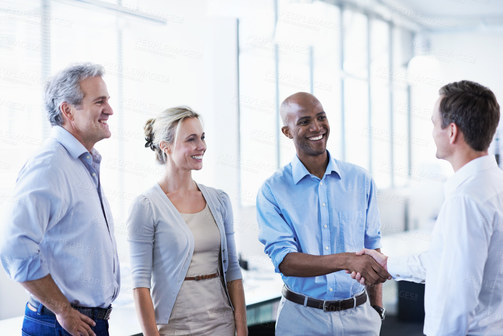 Buy stock photo Smile, handshake and partnership with business people in office for contract, deal and thank you. Meeting, shaking hands and welcome with employees in agency for teamwork, support and opportunity