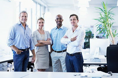 Buy stock photo Portrait of a diverse group of smiling coworkers standing in an office