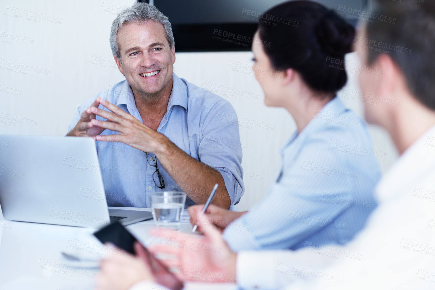Buy stock photo Smile, laptop and meeting with business man in office for liquidity analyst, account review and planning. Discussion, budget forecast and credit balance with employees in agency for funding pitch