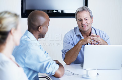 Buy stock photo Portrait of a manager and colleagues having a meeting around a boardroom table
