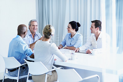 Buy stock photo Shot of a diverse group of businesspeople having a brainstorming session in an office