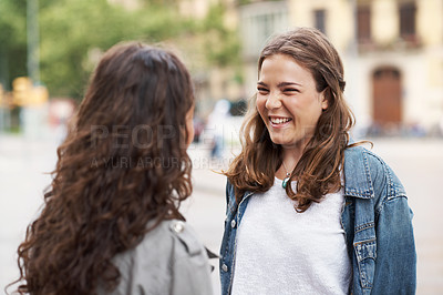 Buy stock photo Two young teen friends standing together happily while outdoors