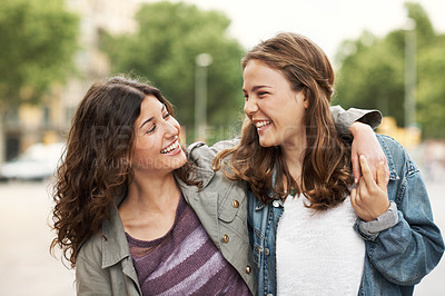 Buy stock photo Two young teen friends standing together happily while outdoors