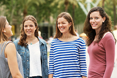 Buy stock photo Group of teen friends standing together and smiling while outdoors