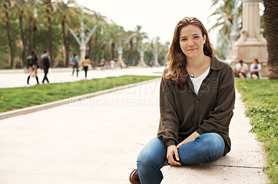 Buy stock photo Attractive teen girl sitting outdoors and smiling