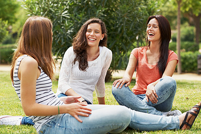 Buy stock photo Group of happy teen friends relaxing together outdoors on the grass