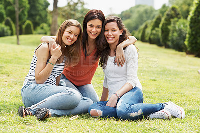 Buy stock photo Group of happy teen friends relaxing together outdoors on the grass