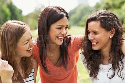Buy stock photo Group of happy teen friends relaxing together outdoors on the grass