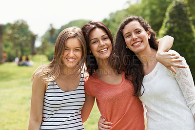 Buy stock photo Group of teen friends standing together and smiling while outdoors