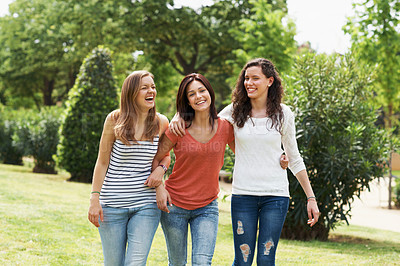 Buy stock photo A group of teen friends walking together while outdoors 