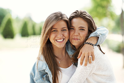 Buy stock photo Two young teen friends standing together happily while outdoors
