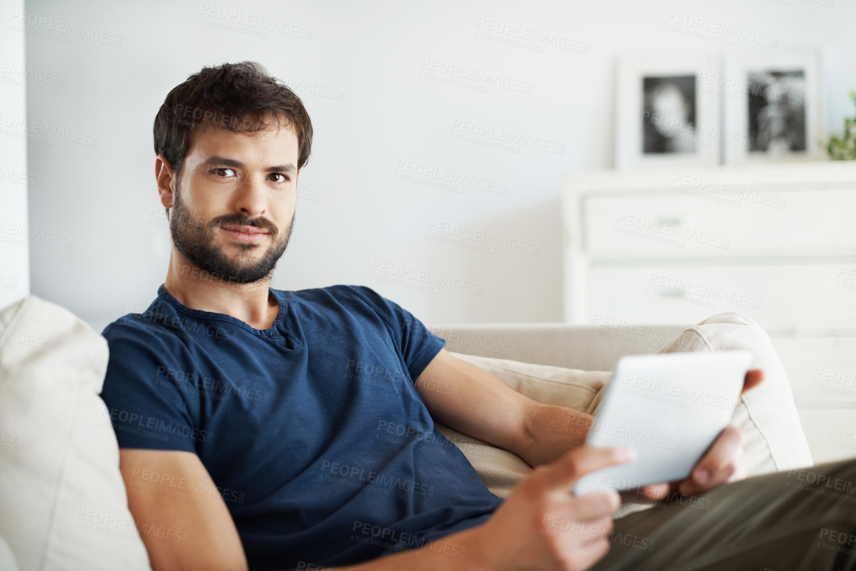 Buy stock photo Tablet, smile and portrait of man on sofa in home for streaming service, movie search and media app. Online film platform, subscription and chill with person in house for connection and entertainment