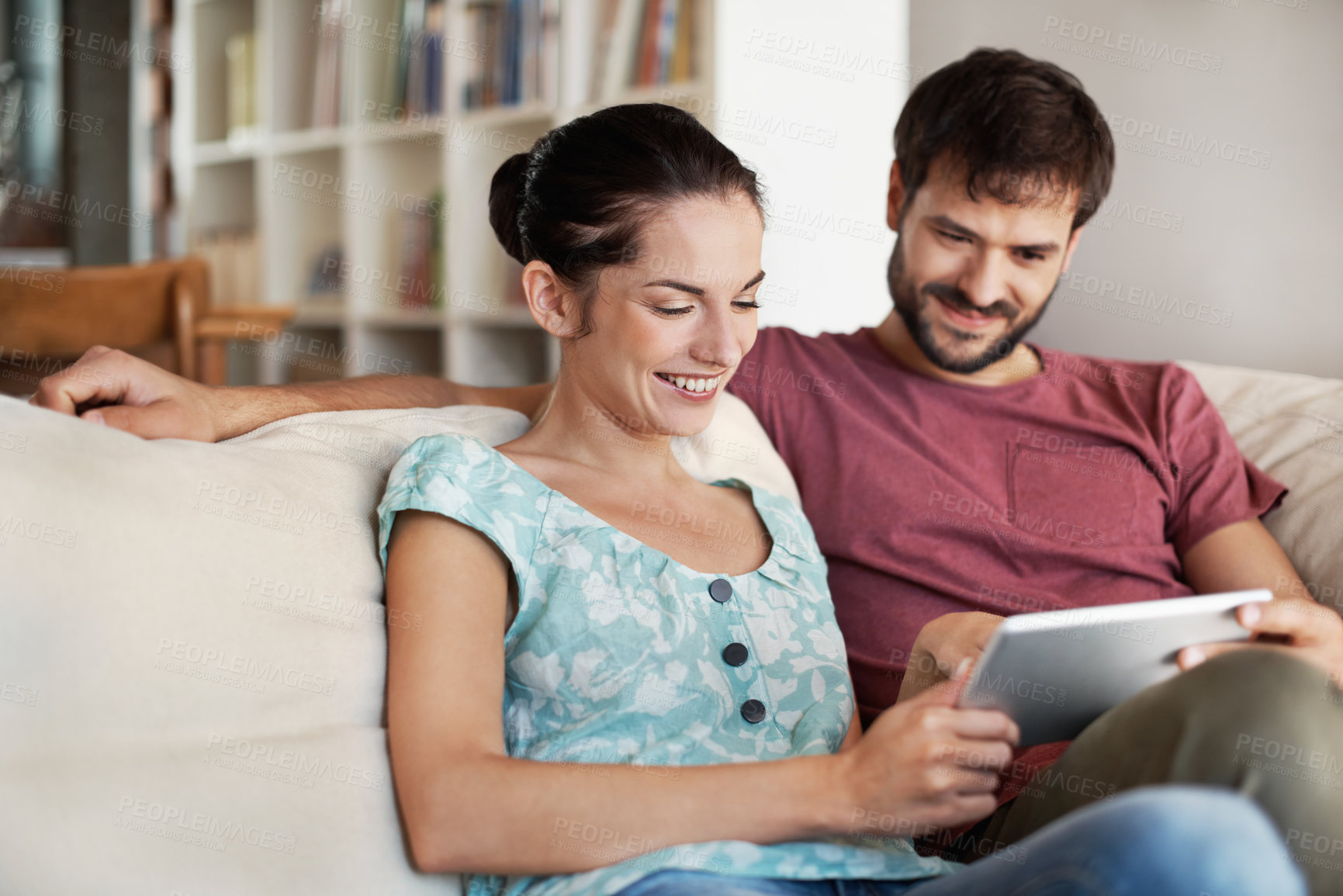 Buy stock photo Tablet, search and reading with couple on sofa in home for honeymoon trip, romantic vacation or love. Travel itinerary, online holiday package and planning with man and woman in living room in house