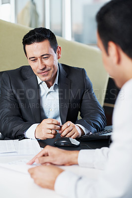 Buy stock photo Two businessmen having a meeting and discussing strategy