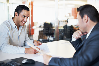 Buy stock photo A manager and his business partner discussing company figures