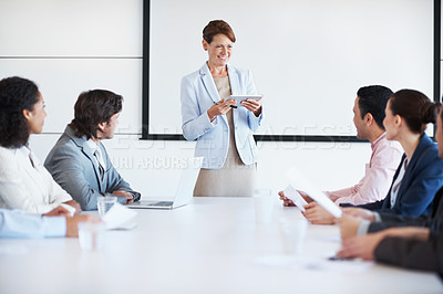 Buy stock photo A company executive giving staff training in a board room