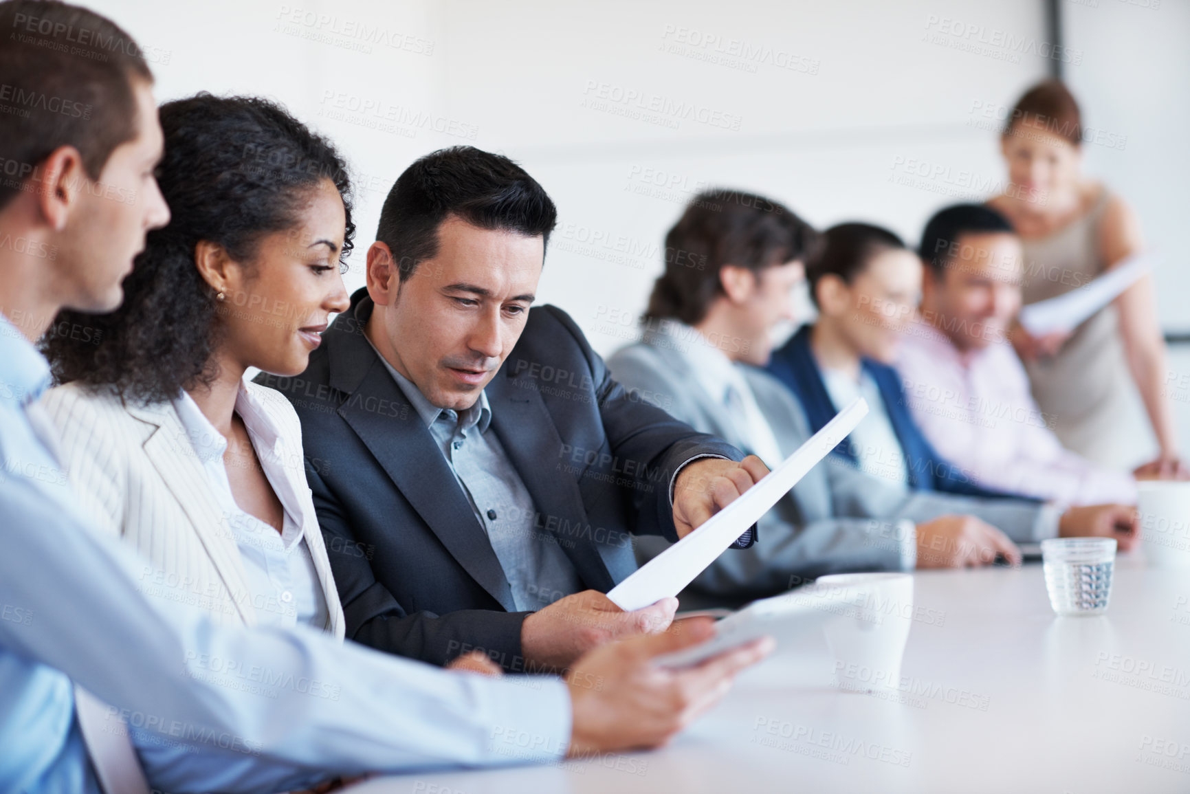 Buy stock photo People, lawyer and meeting in office with document, case file and witness statement for legal trial. Attorney, team and review paperwork for evidence, lawsuit investigation and agenda of court summon