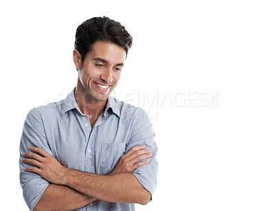 Buy stock photo Handsome man smiling while looking down with his arms folded