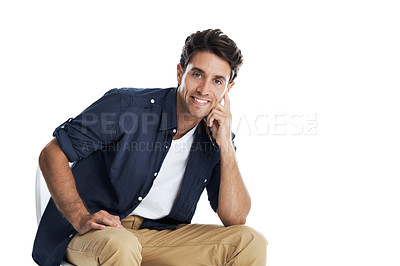 Buy stock photo Handsome young man smiling while sitting on a chair - isolated on white