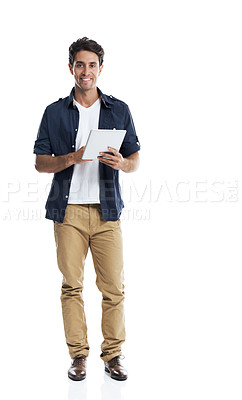 Buy stock photo Handsome young guy standing and using a digital tablet with a smile - isolated on white