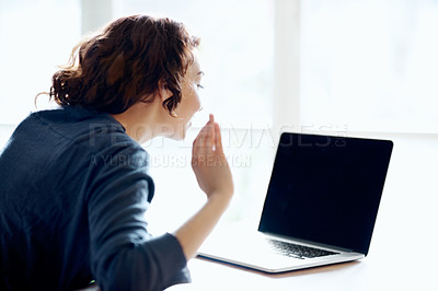 Buy stock photo A young woman waving while video chatting on her laptop