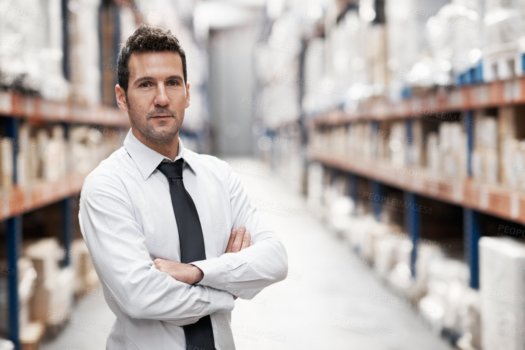 Buy stock photo Businessman, arms crossed and portrait in warehouse for wholesale, logistics or export. Serious, operations manager or confident in storage depot for inventory control, stock or distribution about us