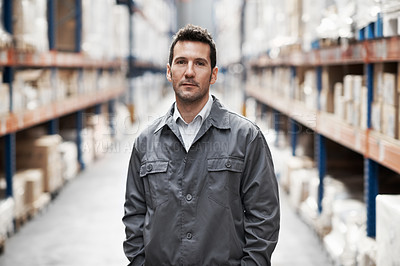 Buy stock photo Portrait of a handsome warehouse worker with his hands in his pockets