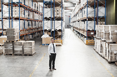 Buy stock photo Portrait of a handsome warehouse worker with his hands in his pockets