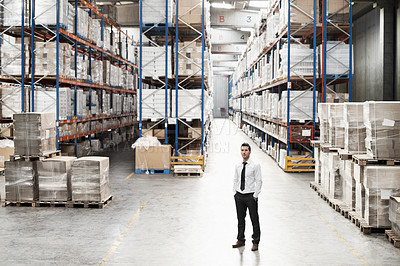 Buy stock photo Portrait of a handsome warehouse worker with his hands in his pockets