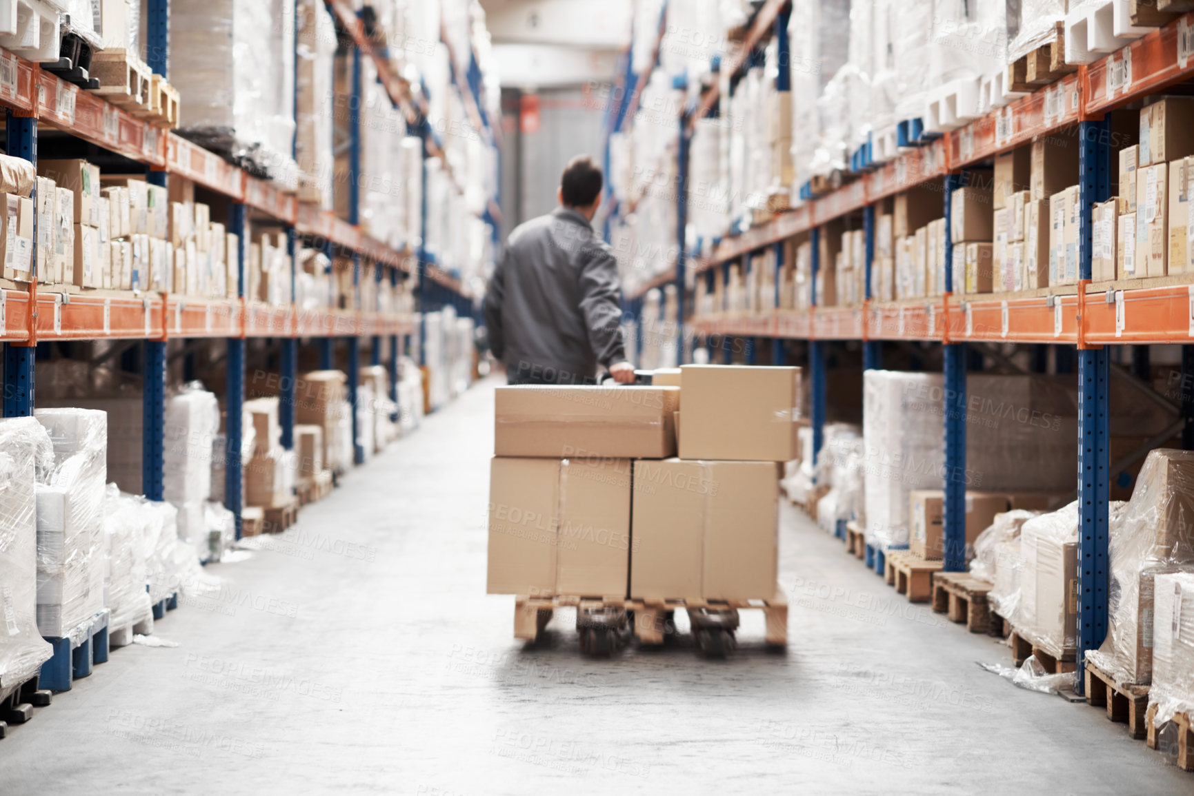 Buy stock photo Man, trolley and boxes in warehouse for logistics, inventory management and stock control. Employee, back or hydraulic pallet jack in depot for efficient storage, distribution or supply chain service