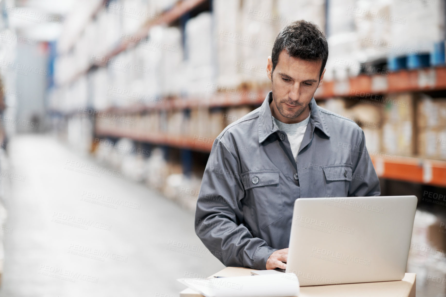 Buy stock photo Reading, shipping and laptop with man in warehouse for courier delivery, logistics schedule or inventory update. Quality control, client feedback and ecommerce with person and tech in factory space